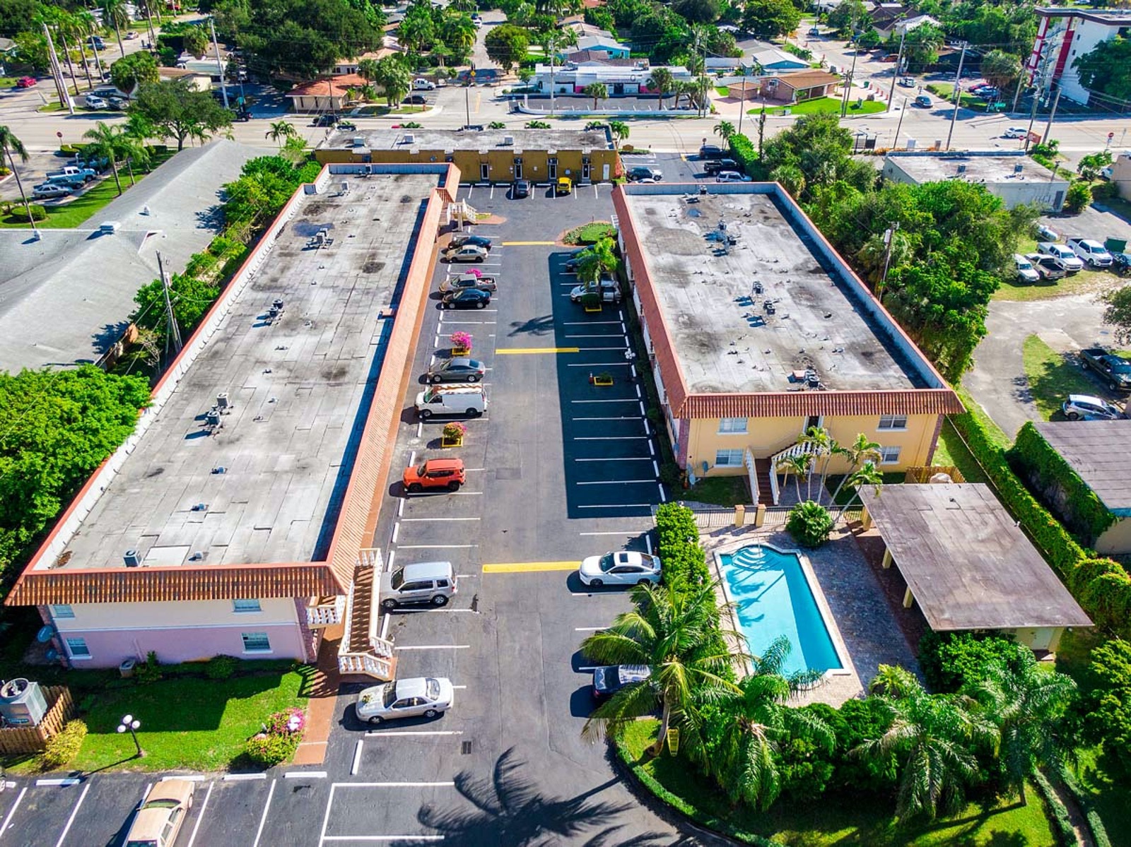 Aerial view of Wilton Pointe Apartments, its pool, and parking area